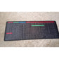 The flexible Shortcut Keyboard Mat rolled up, ready for transport or storage.