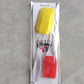 Multicolor silicone spatula and pastry brush set in action.