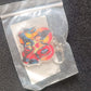 Colorful acrylic keychain featuring cartoon design with metal hardware for easy clipping