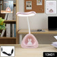 Adjustable LED desk lamp illuminating a study setup