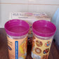 Group of CookAura plastic food containers in a kitchen setting, emphasizing organized storage.