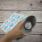 Front view of the hot water bag with its protective fabric cover.