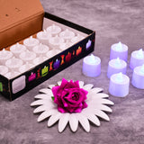 Pink flameless LED tealights glowing softly in a cluster.
