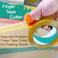 A hand demonstrating the comfortable fit of the Finger Tape Cutter for packing boxes.