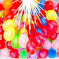 Kids having fun throwing quick-fill Holi water balloons during celebrations.