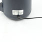 All components of the electric grinder: transparent lid, grinding chamber, and sturdy base.