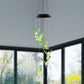 Multicolor LED glowing hummingbird wind chime shining at night