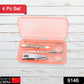 Four stainless steel tools from the manicure set arranged neatly on a surface.