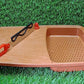 Sturdy plastic cutting board with holder, ready for everyday kitchen tasks.