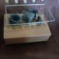 Vertical angle of soap and sponge held by stainless steel sink caddy