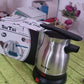 Lifestyle shot of a modern kitchen, suggesting the versatility of the Electric Coffee Maker.