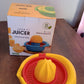 Orange Hand Press Juicer with integrated pulp basket, ensuring clean juice.