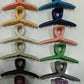 Packaging of Calm & Curl hair claw clips highlighting strong hold features