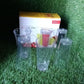 Lifestyle shot of the clear plastic juicy glasses in a modern setting.