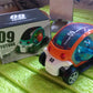 Top-down view of the red rotating stunt car toy, showcasing its compact size and design.
