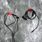 A set of multi-functional hand shape wall clips holding various items like cables and keys.