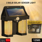 Waterproof solar wall lamp illuminating a lush green garden at night.