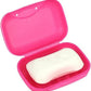 Durable plastic Travel Soap Box on a bathroom counter, open to show space.