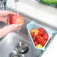 Triangular sink drainer shelf organizing kitchen essentials in a home.