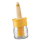 A side view of the transparent oil dispenser bottle, emphasizing its sleek kitchen design.