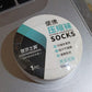 An individual using Pillowva disposable travel socks for a clean foot experience.