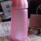 Multiple unique shape plastic water bottles displayed together, showcasing size and design.