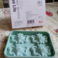 The packaging of the cartoon ice cube tray, indicating a single piece.