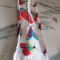 Knotted Wire Headband with an abstract print, displayed neatly on a wooden surface.