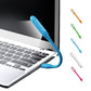 USB LED Light Lamp with a book, highlighting its use for reading.