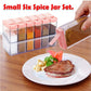 Complete set of six plastic spice jars in assorted vibrant colors.