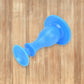 Versatile washer door stopper also functioning as a prop for a room door.