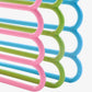 Set of assorted colour 5-layer space saving hangers stacked for compact storage.