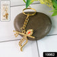 Close-up of Krishna metal keychain showcasing detailed flute and peacock feather craftsmanship