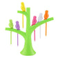 Assorted bird fruit forks displayed in their tree holder, adding fun to table decor.