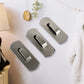 The strong, reusable adhesive backing of a Bathora stainless steel hook for easy installation.