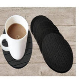 Set of 6 round silicone coasters protecting a table from hot beverages.