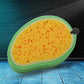 Versatile Mango Dish Sponge tackling tough stains on a kitchen counter.