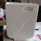 Lifestyle image showing the versatile hanging trash can in a modern home setting.