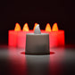 Red flameless tealight candles placed in decorative holders creating ambient lighting