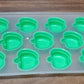 Refreshingly cool fruit-shaped ice cubes floating in a drink.