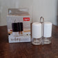 Salt and pepper seasoning dispensers placed neatly on kitchen counter