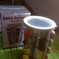 Golden LED spice organizer with 16 jars displayed on a kitchen shelf.