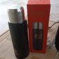 Person holding the Indo Glow stainless steel water bottle.
