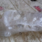 A VelvaBloom disposable shower cap fitted on a mannequin head, showing its universal fit.