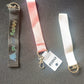 Girl Power fabric ribbon keychain hanging against white background showing mixed colors
