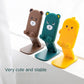 Compact and portable cartoon mobile stand, ideal for travel and desk use.