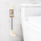 The self-adhesive mop holder demonstrating easy installation on a smooth surface.