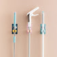 Multiple self-adhesive mop and broom holders neatly arranged on a wall.