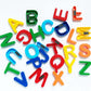 Kids using magnetic letters to form words and learn spelling skills.