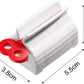 A hand turning the knob of the toothpaste squeezer to effortlessly dispense paste.